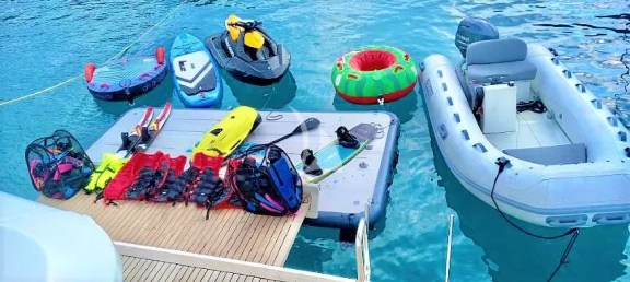 A large inflatable platform is joined (optionally) to the yacht's opening swimming platform - large variety of water toys