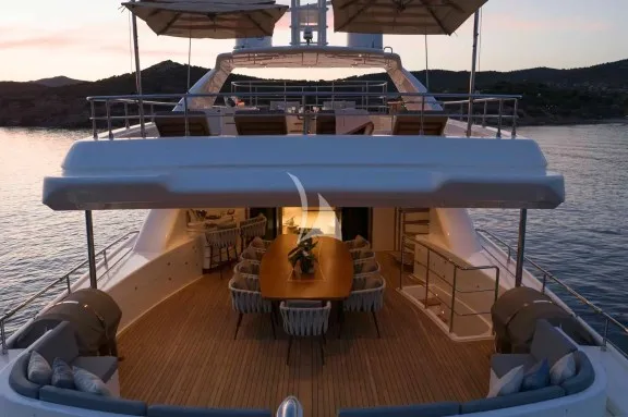 The Upper Deck veranda has a large dining table, a bar and a large sofa
