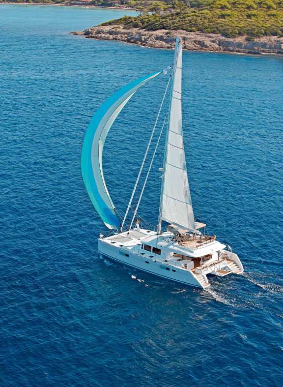 Spinaker sailing in clear blue waters
