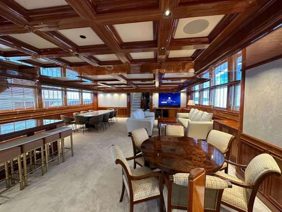 Entry into the Main Salon sees a bar area and dining on the Port side and sofas and a games table on the starboard